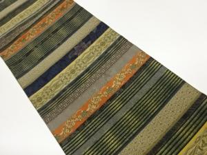 大島紬紙布本泥染横段に菱華紋・花唐草模様織出し袋帯